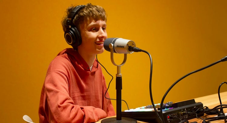 student speaking at a radio station