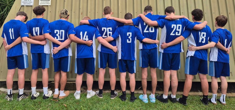 Students with backs to camera in sports coaching shirts