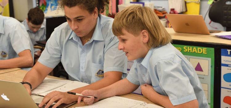 student working in classroom