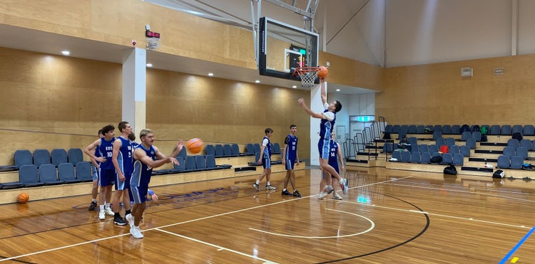 Student playing basketball