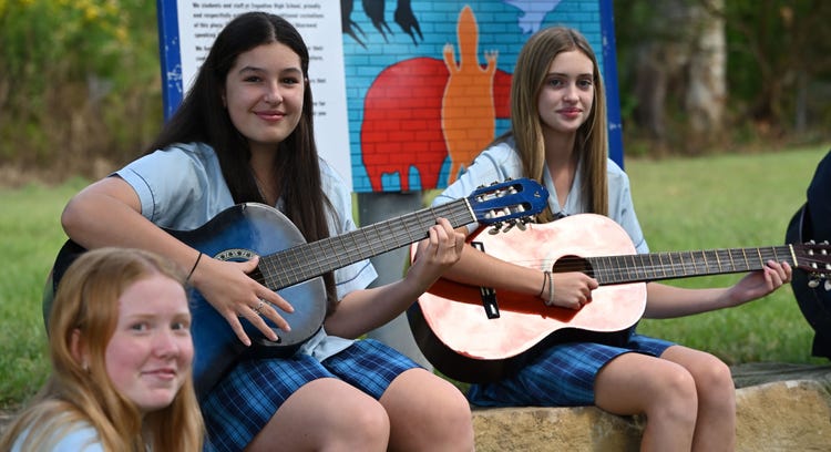 students playing guitar